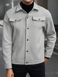 Men's light grey fleece jacket detail, classic lapel, black snap button closure, and chest pockets.