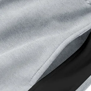 Stof detail heren casual broek grijs zwart kleurblok zijzak stiksels close-up views