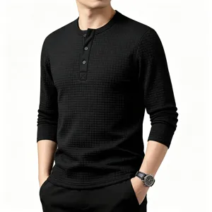 Close-up detail of the black waffle knit long sleeve Henley shirt featuring button placket.