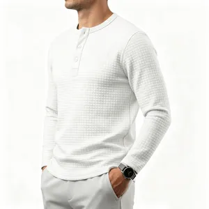 Close-up of men's waffle knit long sleeve henley shirt showing textured fabric and button details.