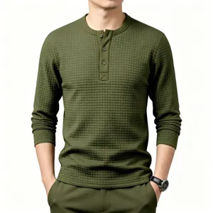 Detail view of men's olive green long sleeve waffle knit henley shirt, textured grid.