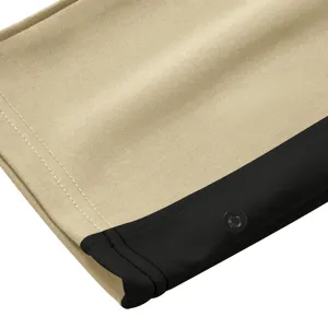 Heren casual broek detailopname, kaki zwarte kleurstelling, knoopaccent, fijne naad.