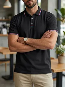Men black polo shirt detail view showing tricolor tipping collar and button placket design.
