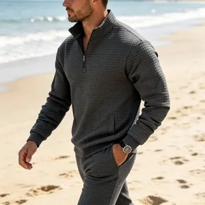 Men's casual waffle knit quarter zip pullover sweatshirt with matching pants for autumn.