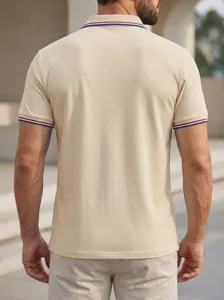 Men's casual beige polo shirt featuring short sleeves and classic striped collar trim.