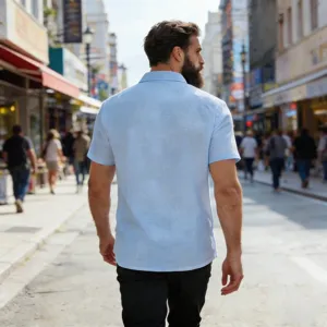 Casual light blue linen short-sleeve shirt back view detail showcasing breathable fabric in street scene
