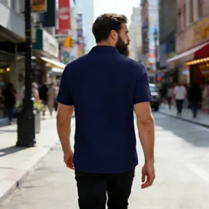 Close-up back view of men's solid blue linen short-sleeve shirt with casual lapel design.
