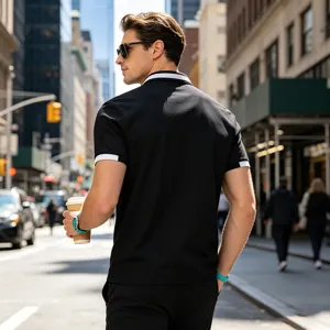 Men's black short sleeve polo shirt with white contrast trim for casual daily wear.
