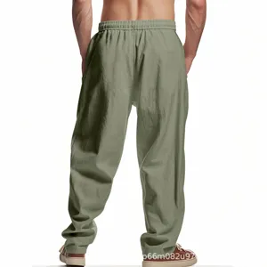 Back view detail of men's casual linen loose trousers, showing breathable baggy fit style.