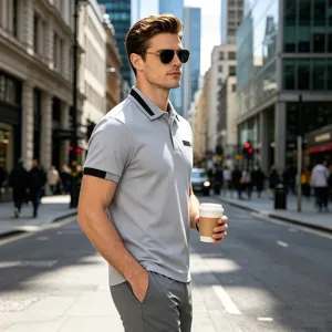 Men's casual slim fit polo shirt detail view showing contrast collar, cuffs and chest pocket.
