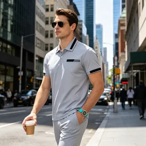 Detail view of men's casual polo shirt set in light grey, featuring contrast trim and pocket.