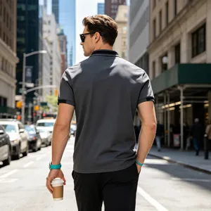 Men's casual short sleeve polo shirt in grey with black collar detail, urban street style.