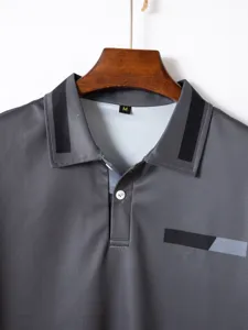 Grey men polo shirt collar detail, casual short sleeve business top with front button closure.