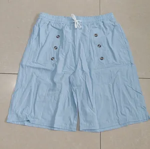 Light blue cotton linen casual mens shorts with drawstring waist and multiple decorative pockets.
