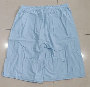 Detail view of light blue men's casual cotton linen shorts with elastic waist and loose fit.