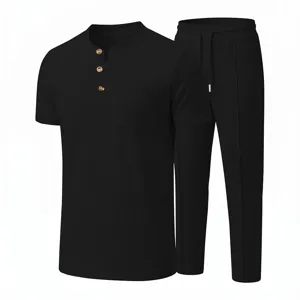 Black waffle knit mens short sleeve henley shirt and matching casual trousers set detail.