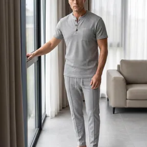 Detail shot of men's waffle knit short sleeve casual set with henley shirt and drawstring pants.