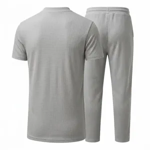 Men grey waffle knit short sleeve shirt and matching trousers clothing detail view