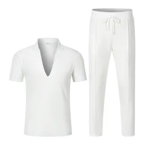 Men waffle knit two piece outfit detail, deep v neck short sleeve shirt and drawstring pants.