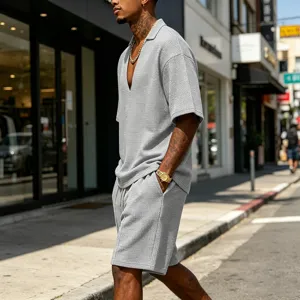 Detailed view of men waffle knit short sleeve V-neck t-shirt and shorts casual set.