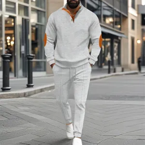 Detailed shot of men's waffle knit half-zip sweatshirt and sweatpants tracksuit set.