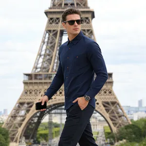 Detail shot of men's casual long sleeve navy blue linen shirt with chest pocket design.