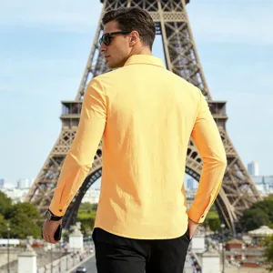 Men's solid yellow long sleeve linen shirt back view in front of the Eiffel Tower.