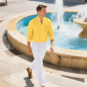Outdoor lifestyle shot showing the casual long-sleeve shirt and linen pants detail.