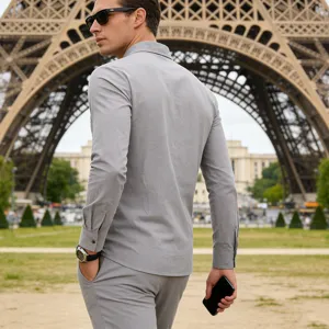 Detail view of men grey linen long sleeve shirt, casual resort style, breathable fabric texture.