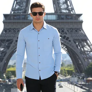 Close-up detail of light blue long sleeve linen shirt with pocket for men casual wear.