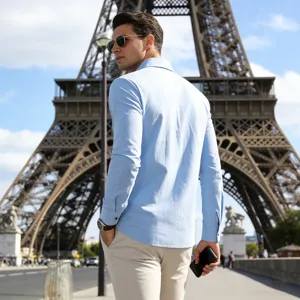 Light blue long sleeve men shirt detail shot, casual breathable linen style outdoor view.