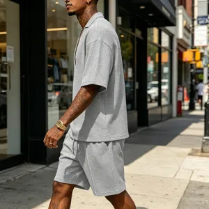 Detail view of men's casual waffle knit two piece set with V-neck polo shirt and shorts.