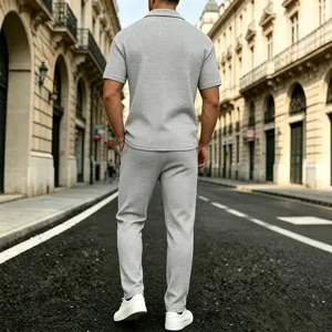 Detailed shot of casual grey waffle knit two piece set in outdoor European street scene.