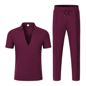 Detail view of men's burgundy V-neck short sleeve top and matching drawstring trousers set.