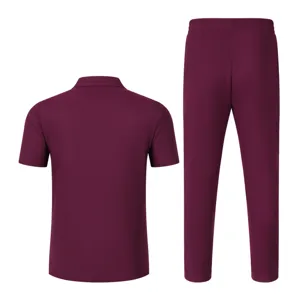 Detailed view of the burgundy men short sleeve polo shirt and trousers fabric and collar design.