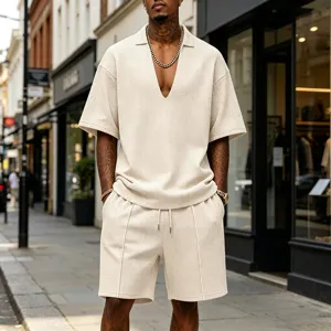 Detailed view of men's casual waffle knit V-neck t-shirt and matching shorts set in beige.