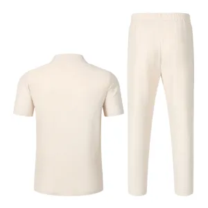 Back detail of casual beige waffle short sleeve polo shirt and pants set for men summer wear.