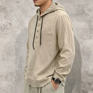 Detailed view of men's casual linen hooded long sleeve shirt with buttons and drawstring.
