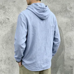 Back view detail of men's casual light blue linen hooded long-sleeve shirt upper body.