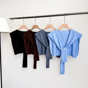 Detailed view of the Korean style hollow out knit shoulder wrap shrug cardigan cape top.