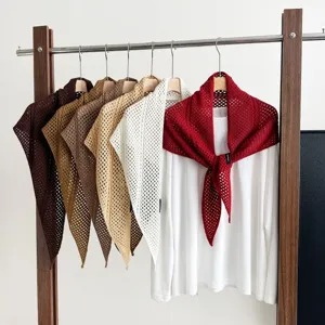 Stylish hollow knit triangle shawl, wool blend solid color fashion scarf for women's daily wear.