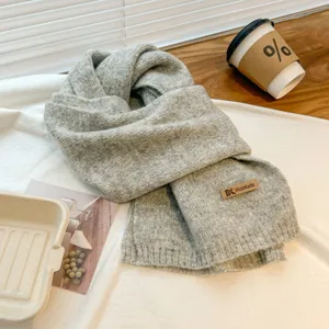 Cozy grey knitted scarf for women and men, winter warm soft neck warmer fashion accessory.