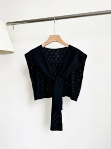 Black floral hollow knit cape for women, spring summer lightweight shawl and cardigan layer.