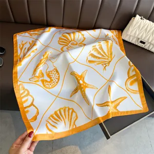 Detailed view of the marine print silk square scarf showcasing seashell and mermaid design.