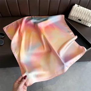 Closeup view of the artistic gradient printed silk square scarf, showing smooth texture and details.