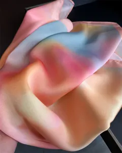 Close up detail of soft gradient silk scarf showing smooth texture and beautiful pastel colors.