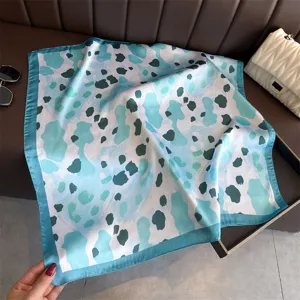 Blue abstract leopard print silk scarf detail, elegant square neck scarf for women.