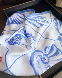 Blue and white seashell printed silk square scarf for women chic beach vacation headwear.