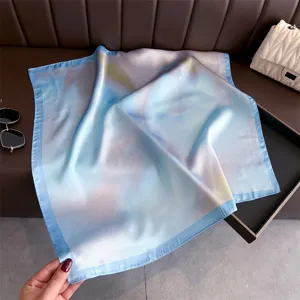 Details of the elegant blue printed silk square scarf for women's stylish neck wear.