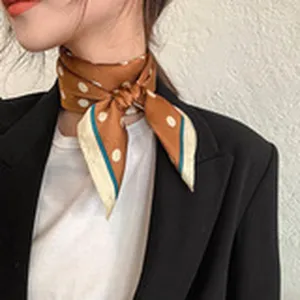 Stylish women's polka dot silk scarf neckerchief chic accessory for daily outfit wear detail.